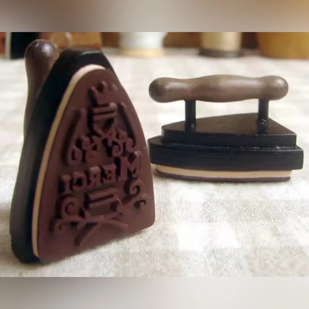 $1 FRENCH MERCI STAMP. IRON SHAPED. NEW $1 WITH ANY $10 ORDER OR MORE